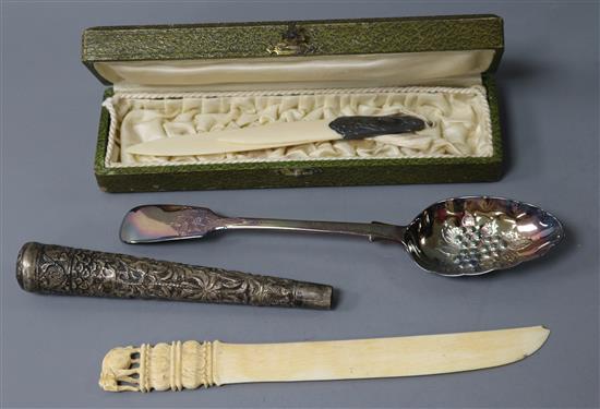 An Indian Silver baton handle, an Indian ivory paperknife, a silver berry spoon etc